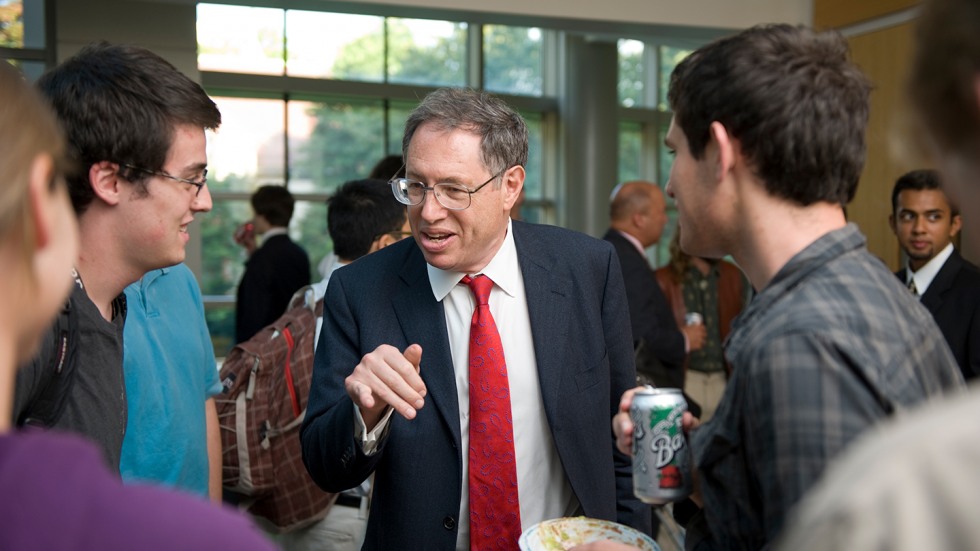 Students mingle with guest lecturer after a Janus event