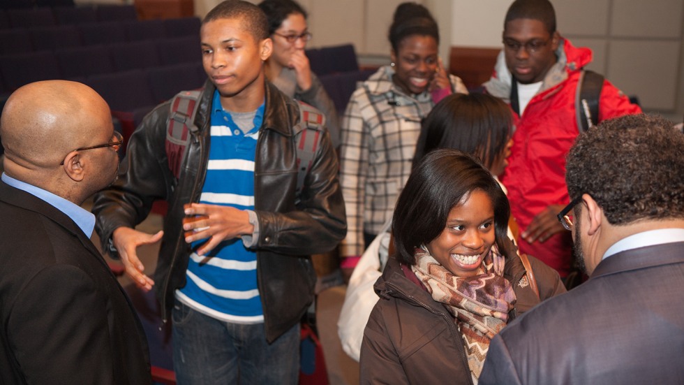 Students mingle with guest lecturer after a Janus event